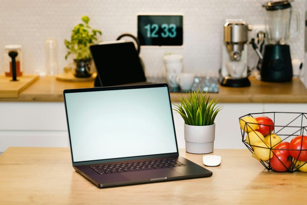 Self-Managing a Costa del Sol Holiday Rental: An Owner Decision Guide 4 Laptop on a table inside a bright holiday apartment