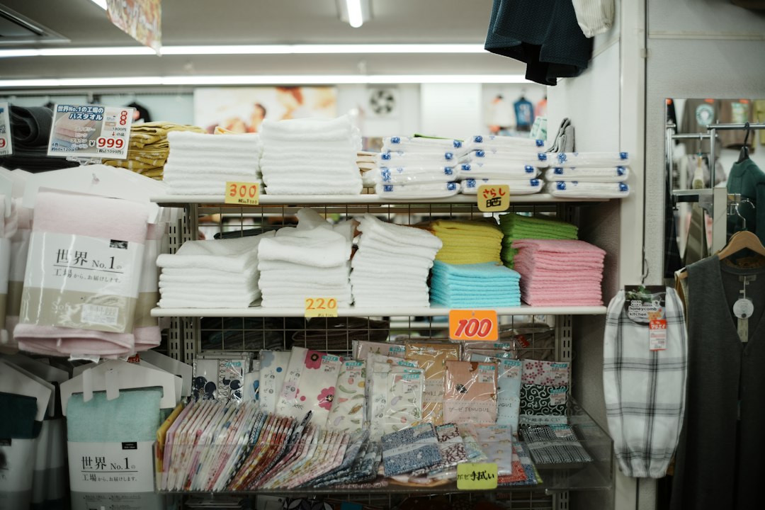 Holiday-Home Inventory: An Owner’s Practical Guide 1 Folded towels and clothing arranged on shelves; illustrative stock photograph